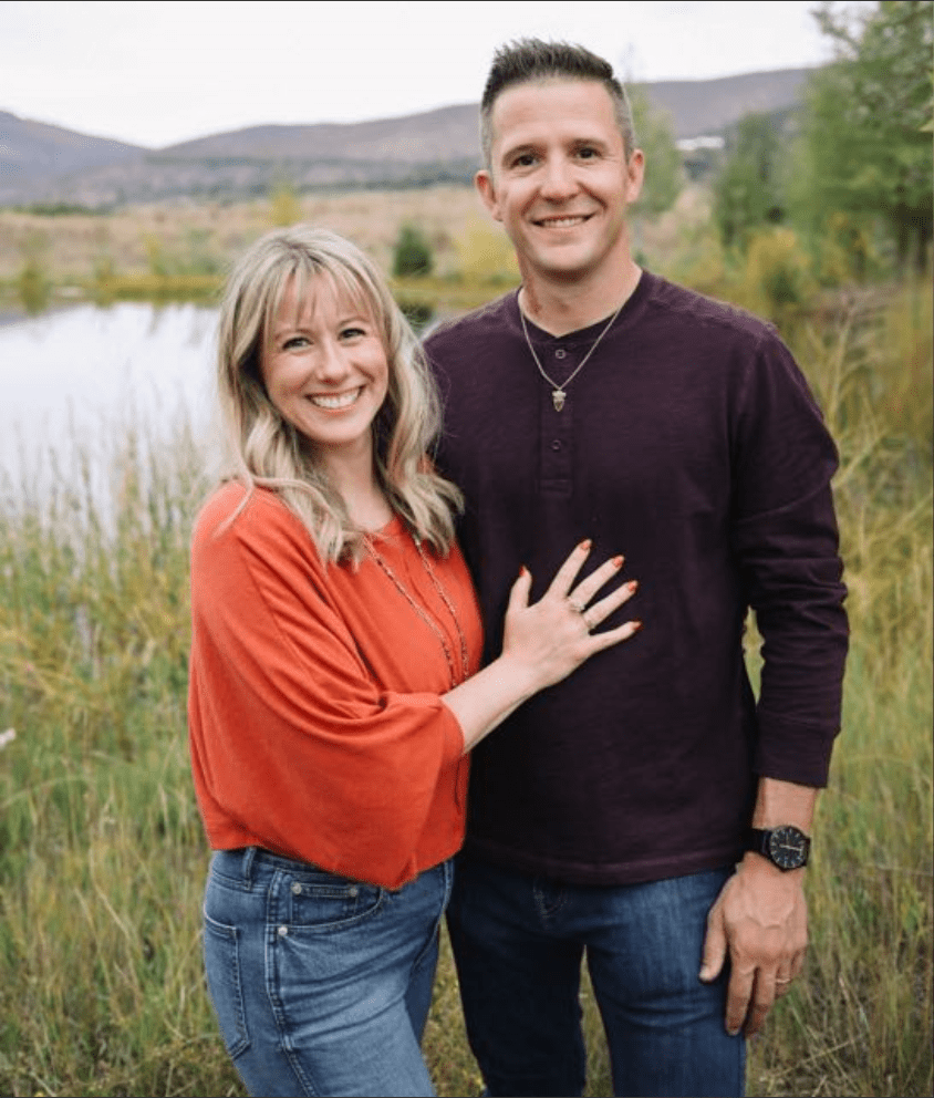 The client and his wife in front of a lake